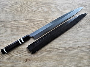 Show details for Akazawa Togashi Ao-Ko Hongasumi Yanagi 300mm Free upgrade Gokujyou Ebony Saya Cover ( Semi handmade )(Market price $138)+ Ebony Triple White Ring Picture of Akazawa Togashi Ao-Ko Hongasumi Yanagi 300mm Free upgrade Gokujyou Ebony Saya Cover ( Semi handmade )(Market price $138)+ Ebony Triple White Ring